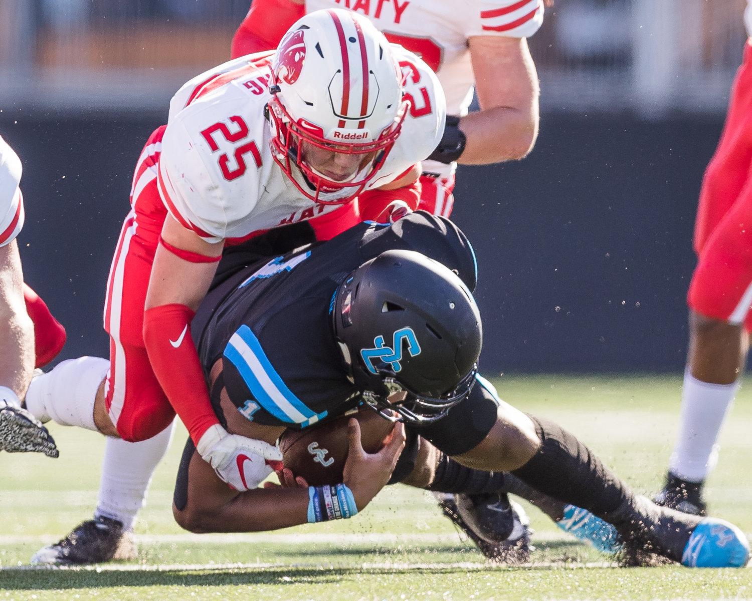 Katy High senior linebacker Shepherd Bowling (25) makes a tackle during the Tigers’ 49-24 Class 6A-Division II regional semifinal win over Shadow Creek on Saturday, Dec. 26, at Freedom Field in Iowa Colony.